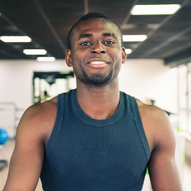 Arron Stephens in the gym in his workout clothes.